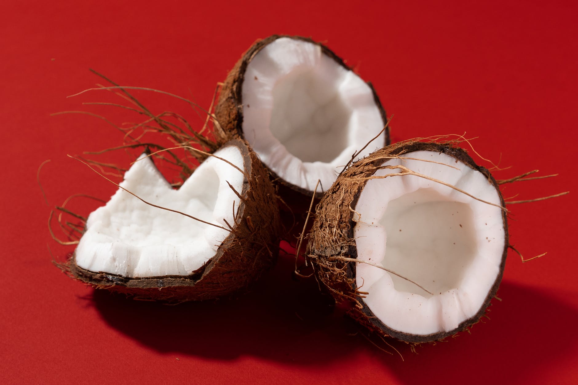 a close up shot of opened coconuts