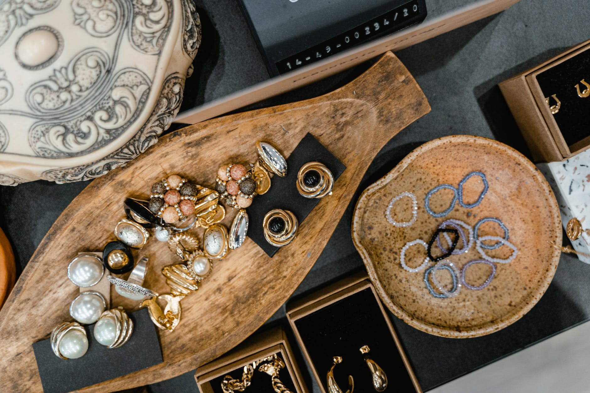 gemstones and jewelries on a wooden tray